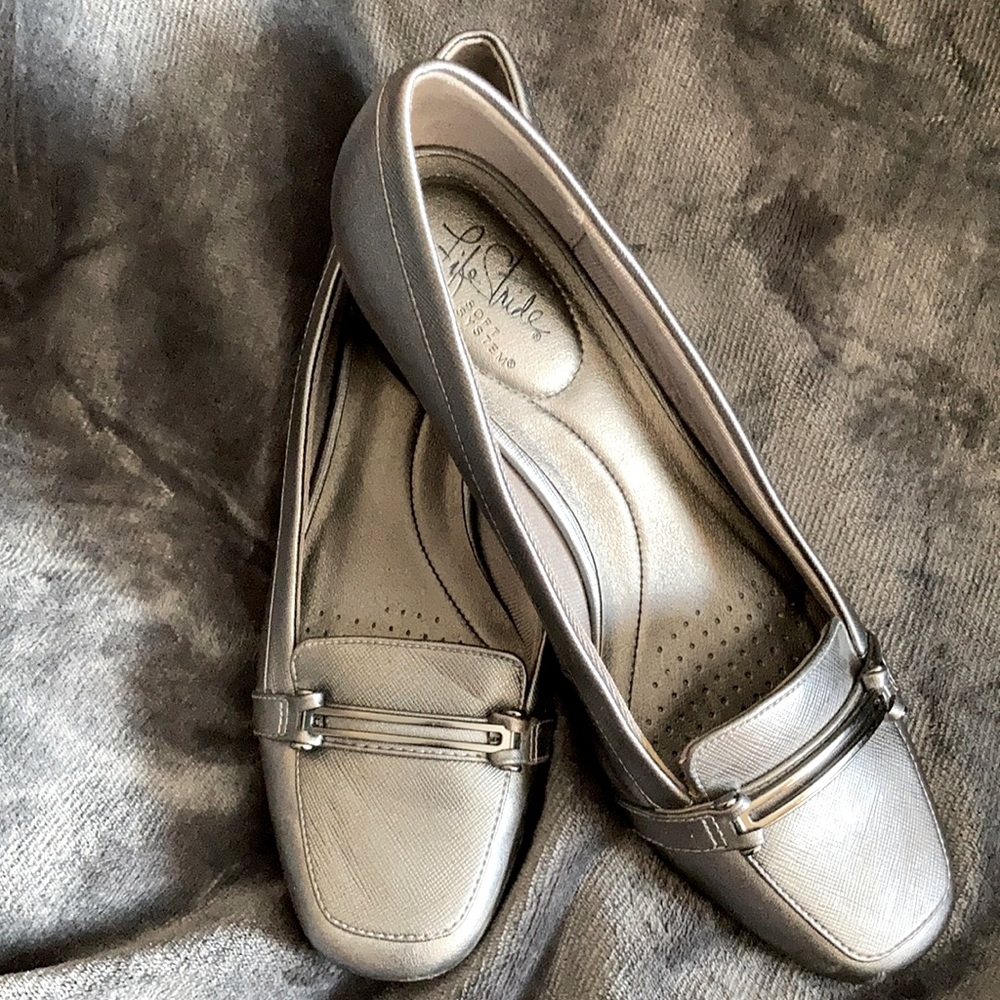 Life Stride silver pump with metal embellishment on front.